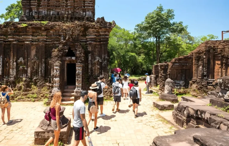 Visitors exploring My Son Holyland ancient Champa temples during sunset with guided cultural experience