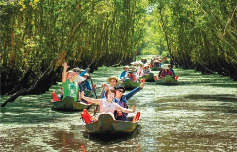 Tourists enjoying a boat ride through Tra Su Cajuput Forest in Mekong Delta, Vietnam travel experience