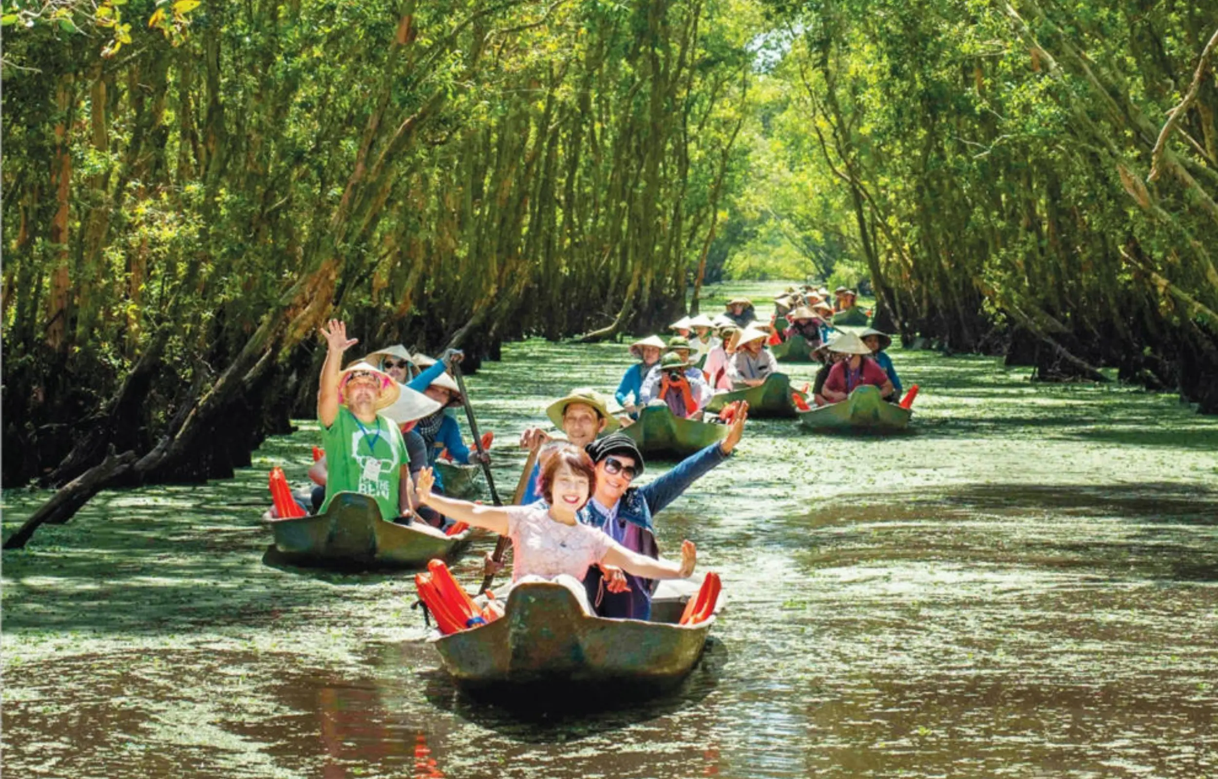 Tourists enjoying a boat ride through Tra Su Cajuput Forest in Mekong Delta, Vietnam travel experience