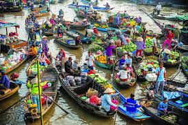 Cai Rang Floating Market in Can Tho with colorful boats trading fruits and local goods on the river in the Mekong Delta, Vietnam