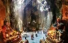 Visitors exploring Am Phu Cave inside Marble Mountains in Da Nang, Vietnam, a spiritual site featured in Marble Mountains, Monkey Mountain, and Da Nang by night cruise tour