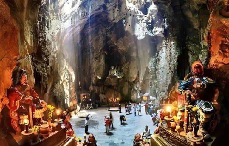 Visitors exploring Am Phu Cave inside Marble Mountains in Da Nang, Vietnam, a spiritual site featured in Marble Mountains, Monkey Mountain, and Da Nang by night cruise tour