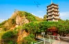 Marble Mountains in Da Nang, Vietnam featuring a traditional pagoda, limestone hills, and lush greenery under a clear blue sky