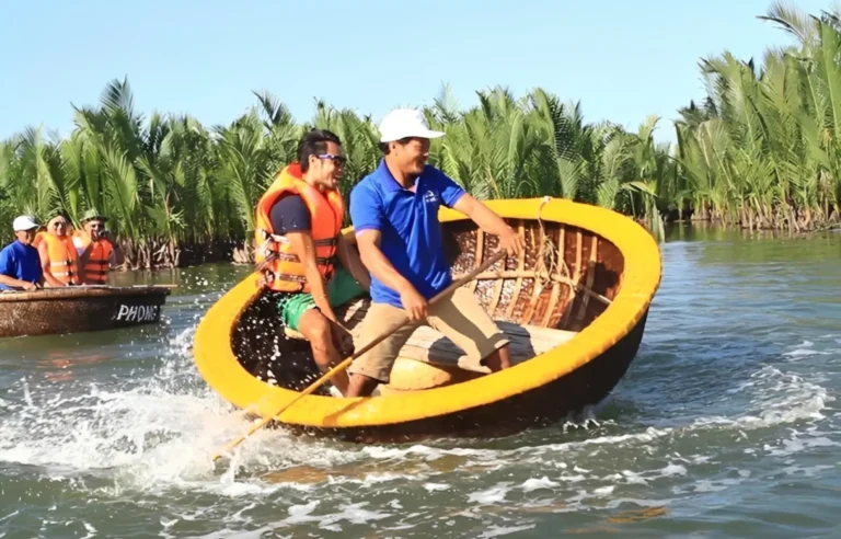 Tourists enjoying Mekong basket boat spinning experience through coconut forest canals in Vietnam