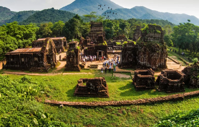 Aerial view of My Son Holyland UNESCO World Heritage Site with ancient Cham temple ruins surrounded by green mountains in central Vietnam