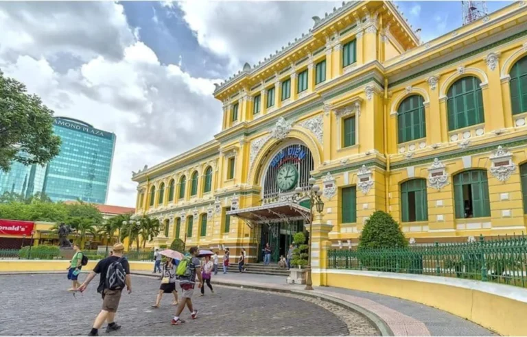 Tourists visiting Saigon Central Post Office in Ho Chi Minh City Vietnam travel