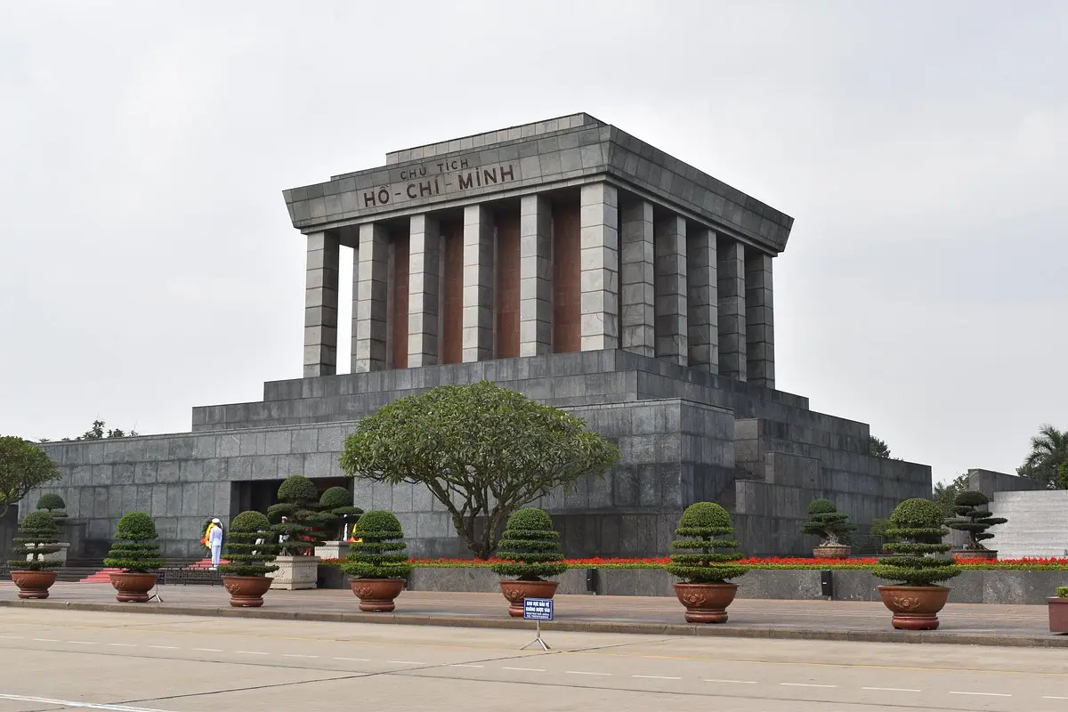 Ho Chi Minh Mausoleum Complex at Ba Dinh Square in Hanoi with visitors and national flags