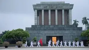 Ho Chi Minh Mausoleum Complex at Ba Dinh Square in Hanoi with visitors and national flags