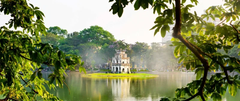 Hoan Kiem Lake Hanoi with Turtle Tower in the middle of the lake, peaceful morning view in the city center