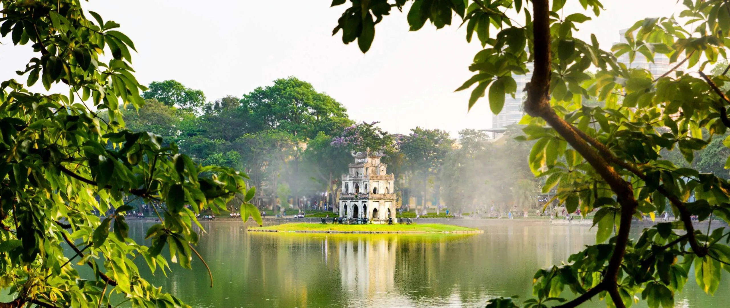 Hoan Kiem Lake Hanoi with Turtle Tower in the middle of the lake, peaceful morning view in the city center