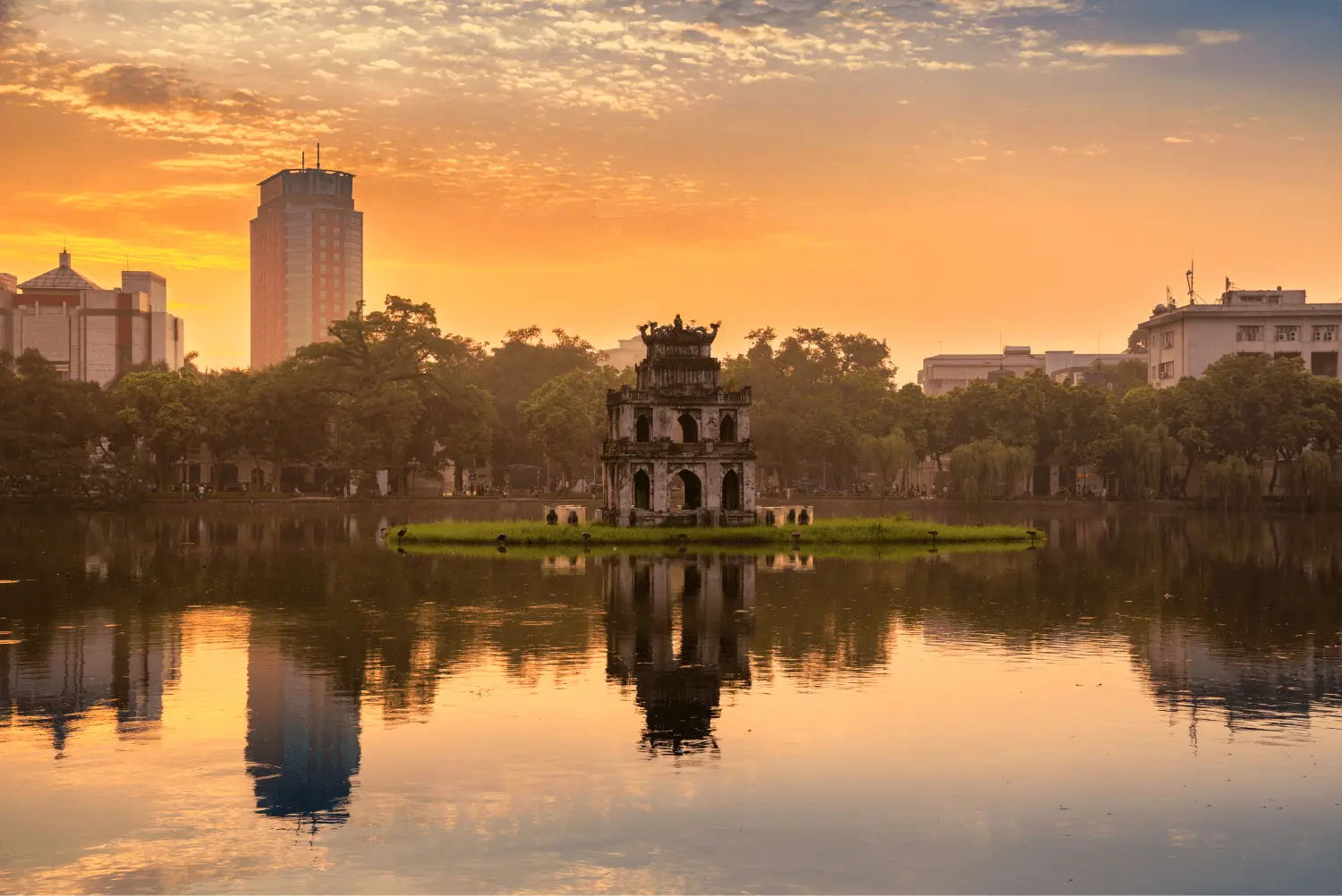 Hoan Kiem Lake in Hanoi with Turtle Tower reflected on the water, a famous travel attraction in Vietnam