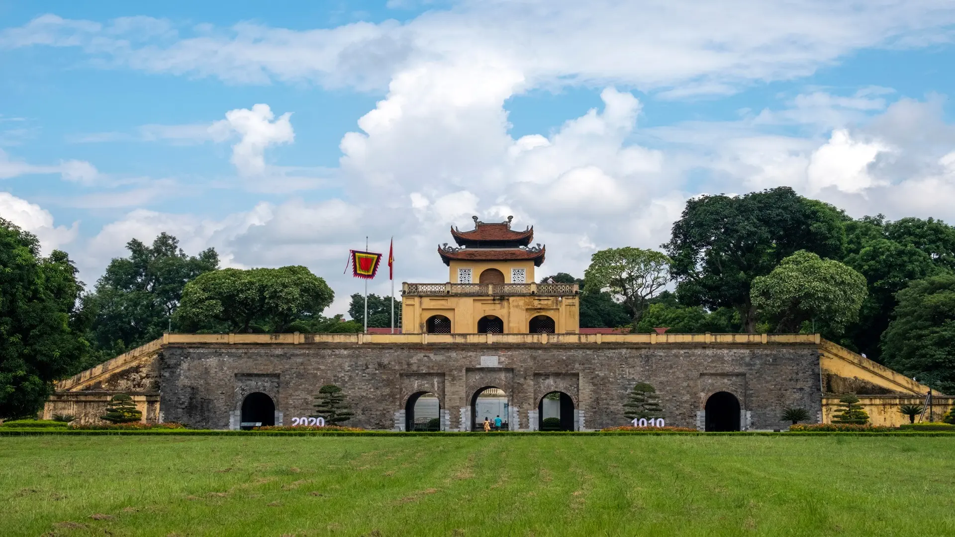 Imperial Citadel of Thang Long in Hanoi with ancient gate and visitors exploring the heritage site