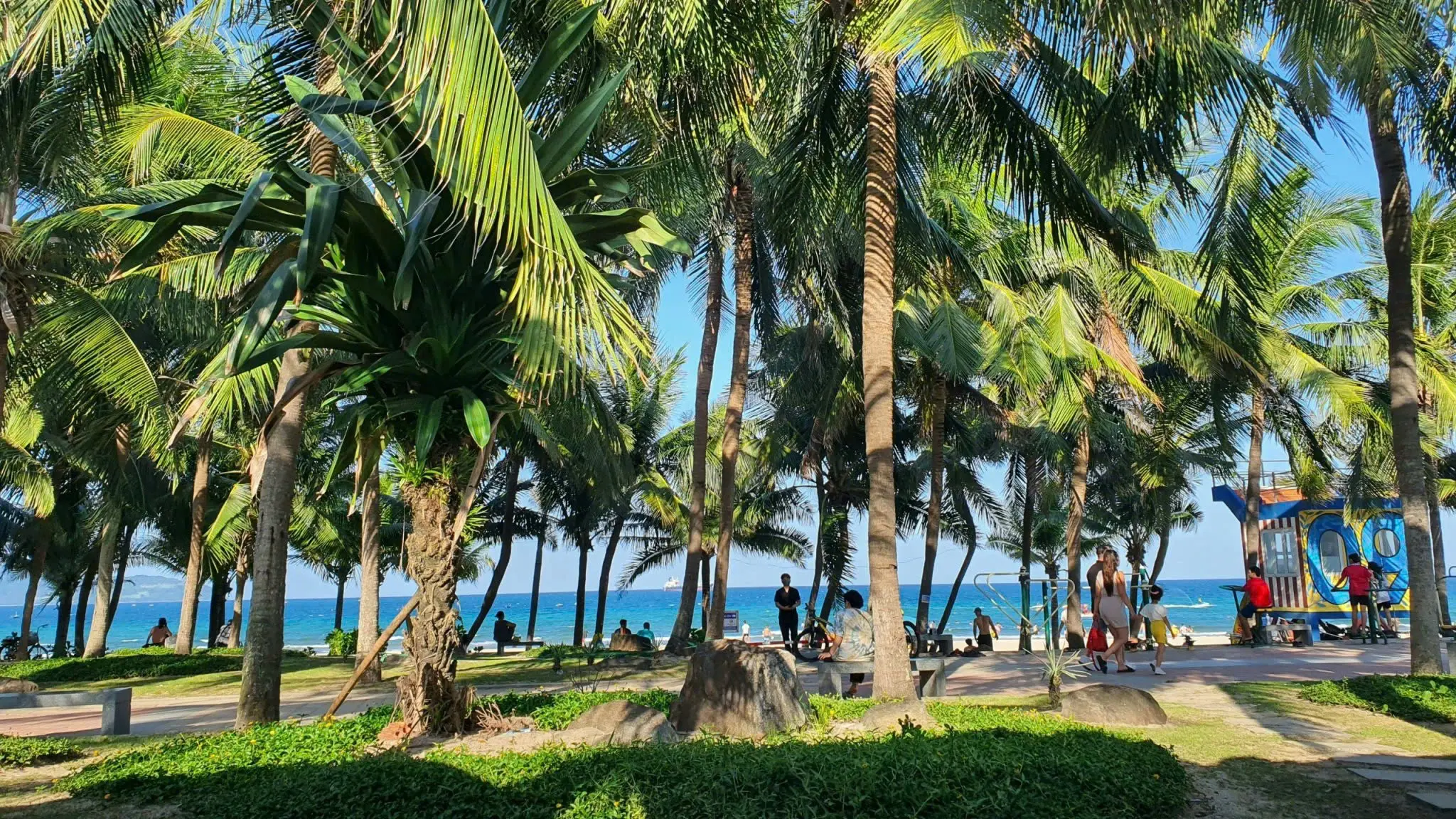 My Khe Beach in Da Nang with white sand, clear blue water, and a peaceful coastline under a bright tropical sky