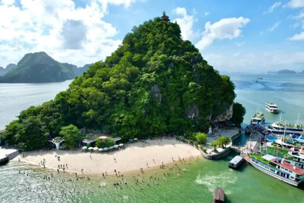 Titop Island beach and viewpoint surrounded by limestone karsts in Ha Long Bay