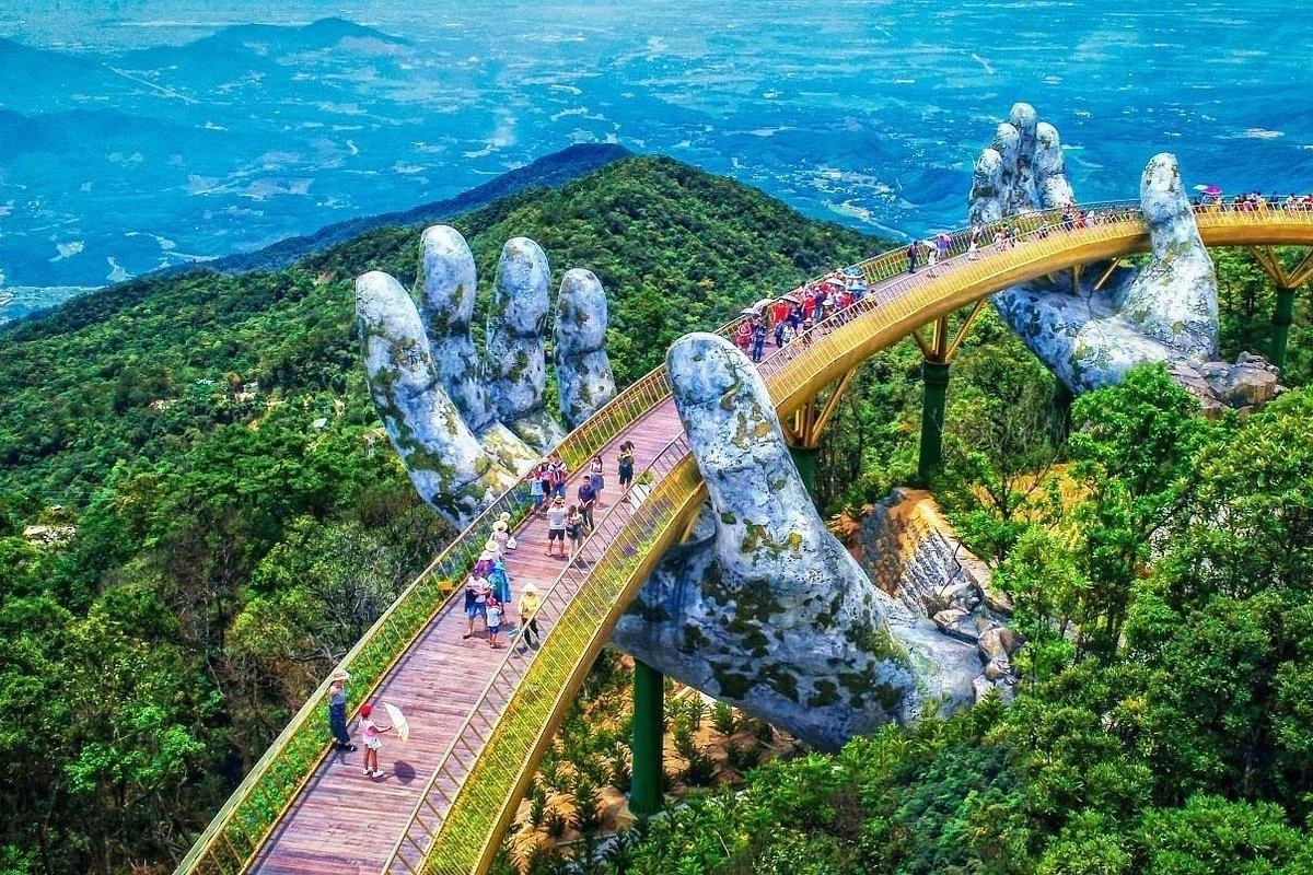 Golden Bridge supported by giant stone hands at Ba Na Hills in Da Nang.