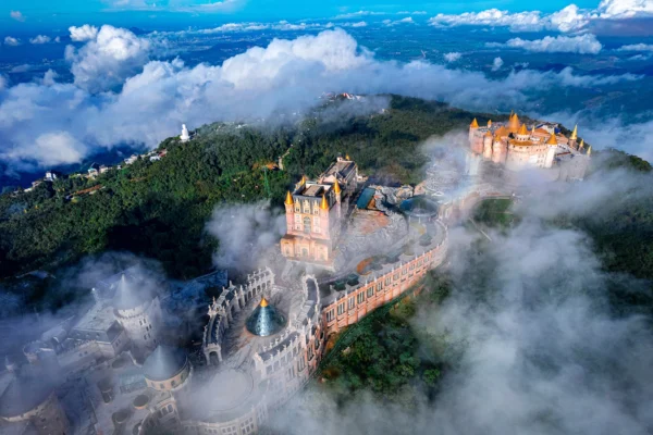 Aerial view of castles and buildings surrounded by clouds at Ba Na Hills.