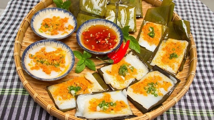 Traditional Hue dishes banh beo and banh nam served with fish sauce and shrimp toppings