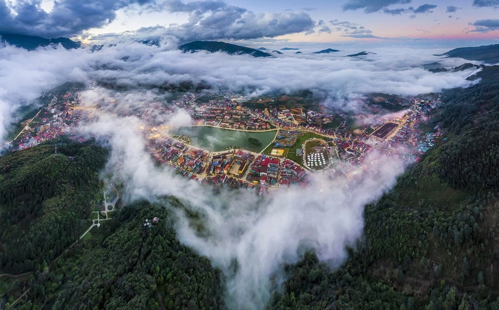Aerial view of Sapa town surrounded by mist and clouds from Ham Rong Mountain