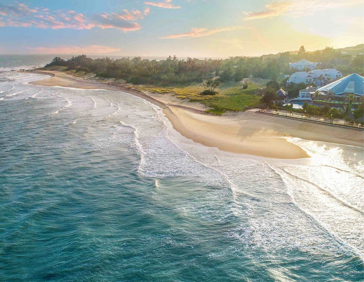 Sunset view of Ho Tram beach coastline with waves and seaside resorts in Vietnam