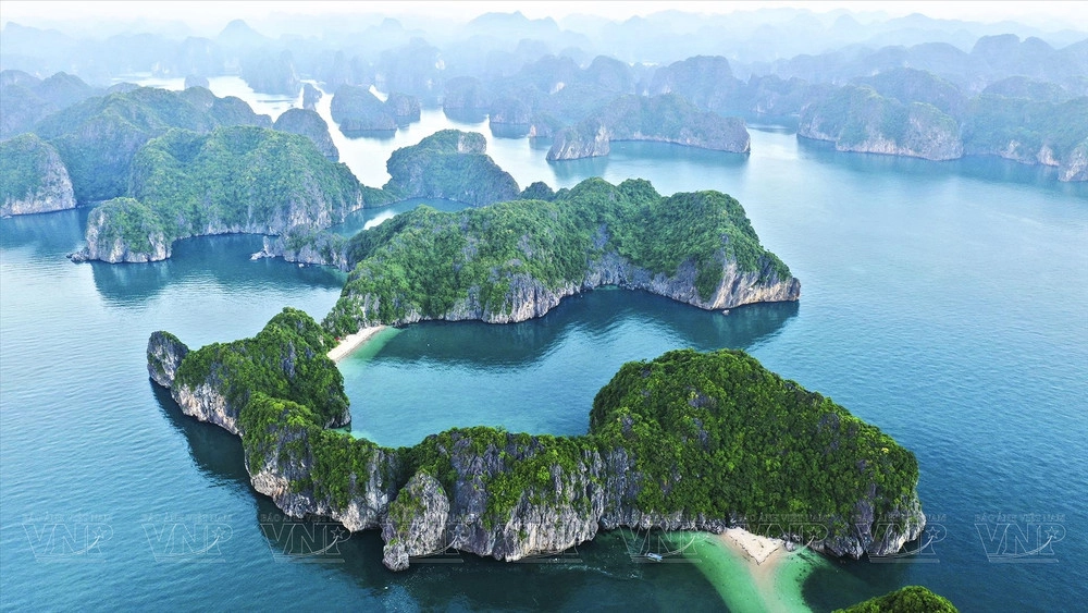 Limestone karst islands surrounded by emerald water in Lan Ha Bay near Cat Ba Island.