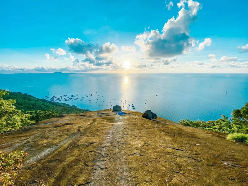 View from Ma Thien Lanh Peak overlooking Hon Son Island with mountains, sea, and sunrise scenery.