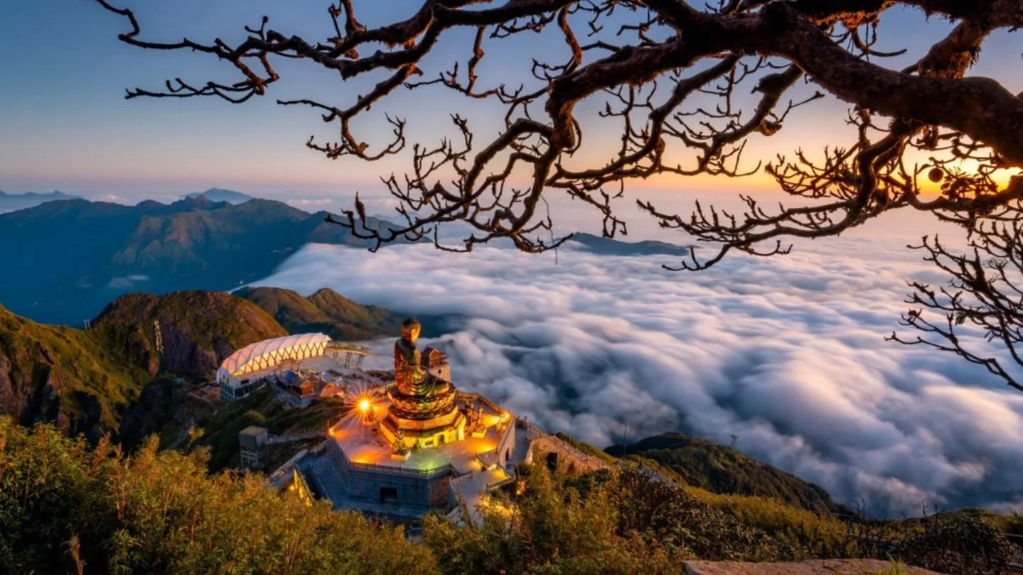 Sea of clouds at Fansipan with mountain peaks rising above mist in Sapa.