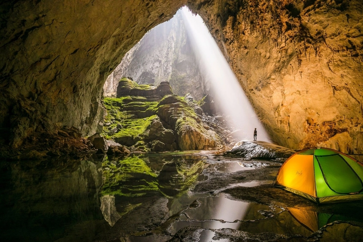 Son Doong Cave giant chamber with sunlight and camping tent in Quang Binh Vietnam