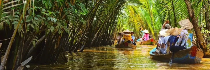 Aerial overview of Con Thoi Son island surrounded by Mekong River with lush greenery and waterways