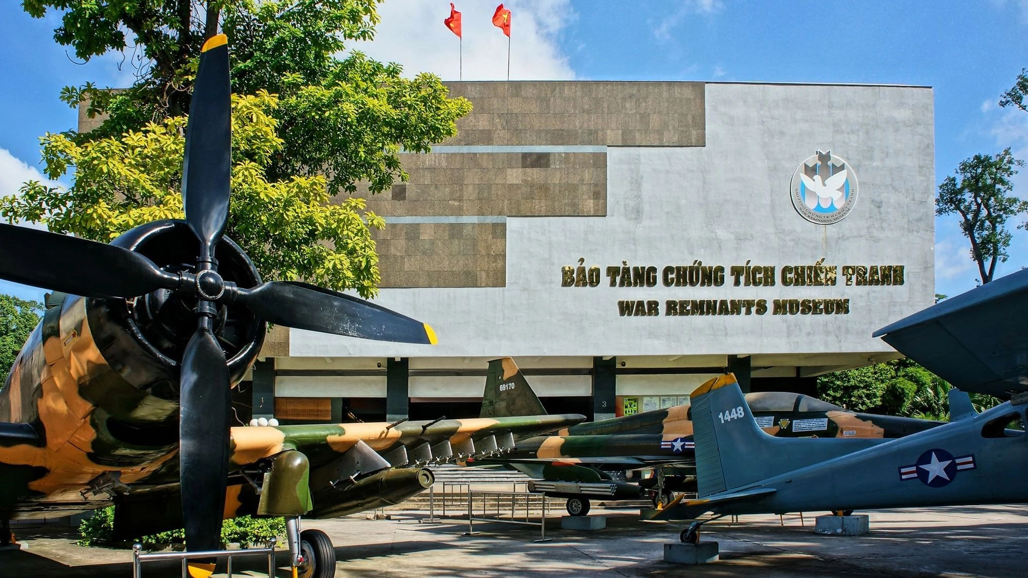 Exterior of War Remnants Museum displaying military aircraft and tanks in Ho Chi Minh City