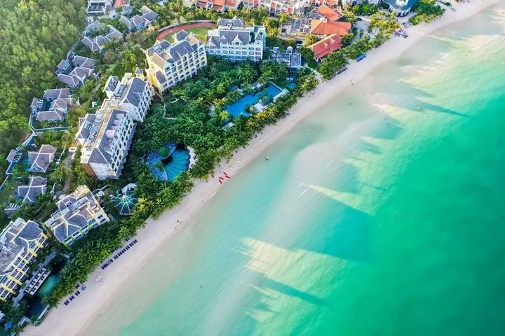 Aerial view of luxury beach resorts and turquoise sea in Phu Quoc Island, Vietnam by Star Tour.Title ảnh: