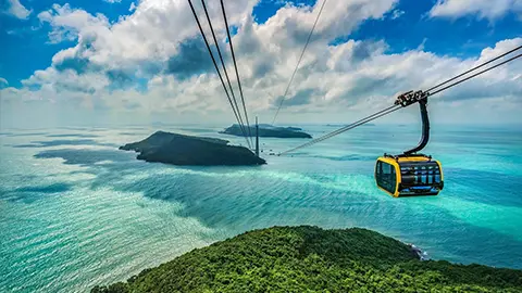 The Hon Thom Cable Car glides above the turquoise sea and lush tropical islands in Phu Quoc Vietnam, offering breathtaking panoramic views of the Gulf of Thailand.