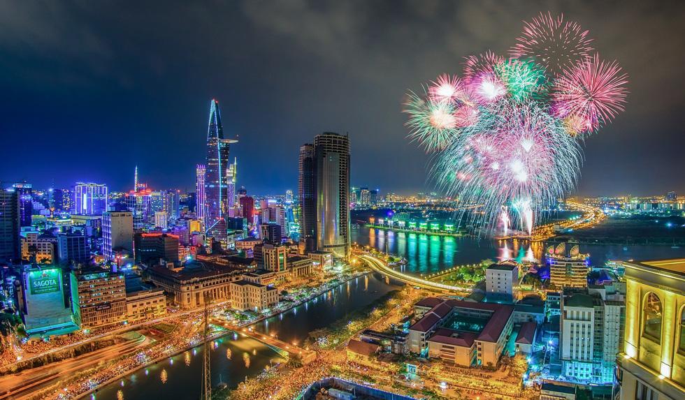 Spectacular fireworks over Ho Chi Minh City skyline celebrating 50 years of bearing President Ho Chi Minh name